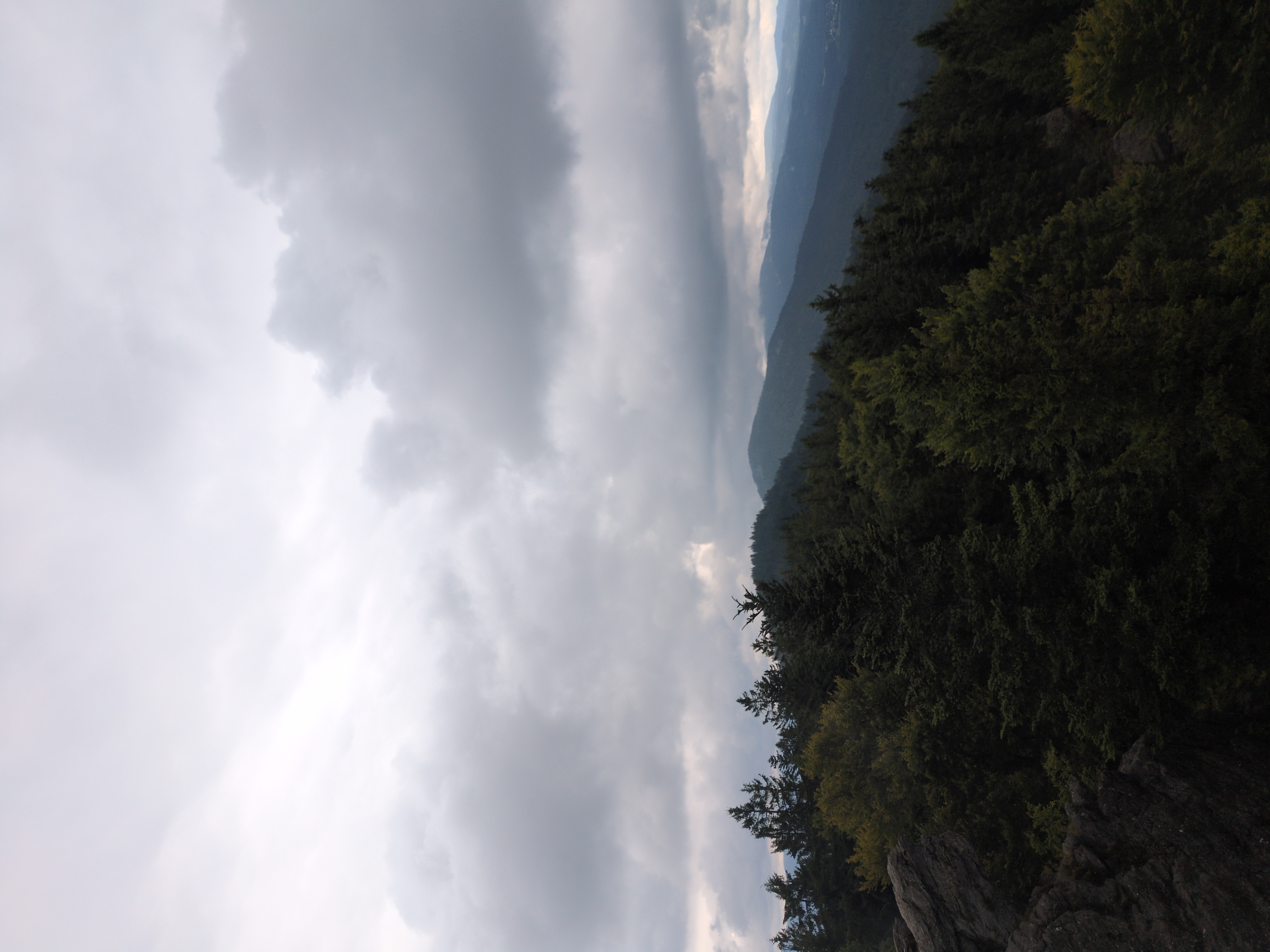 A mountain range with dark clouds overhead