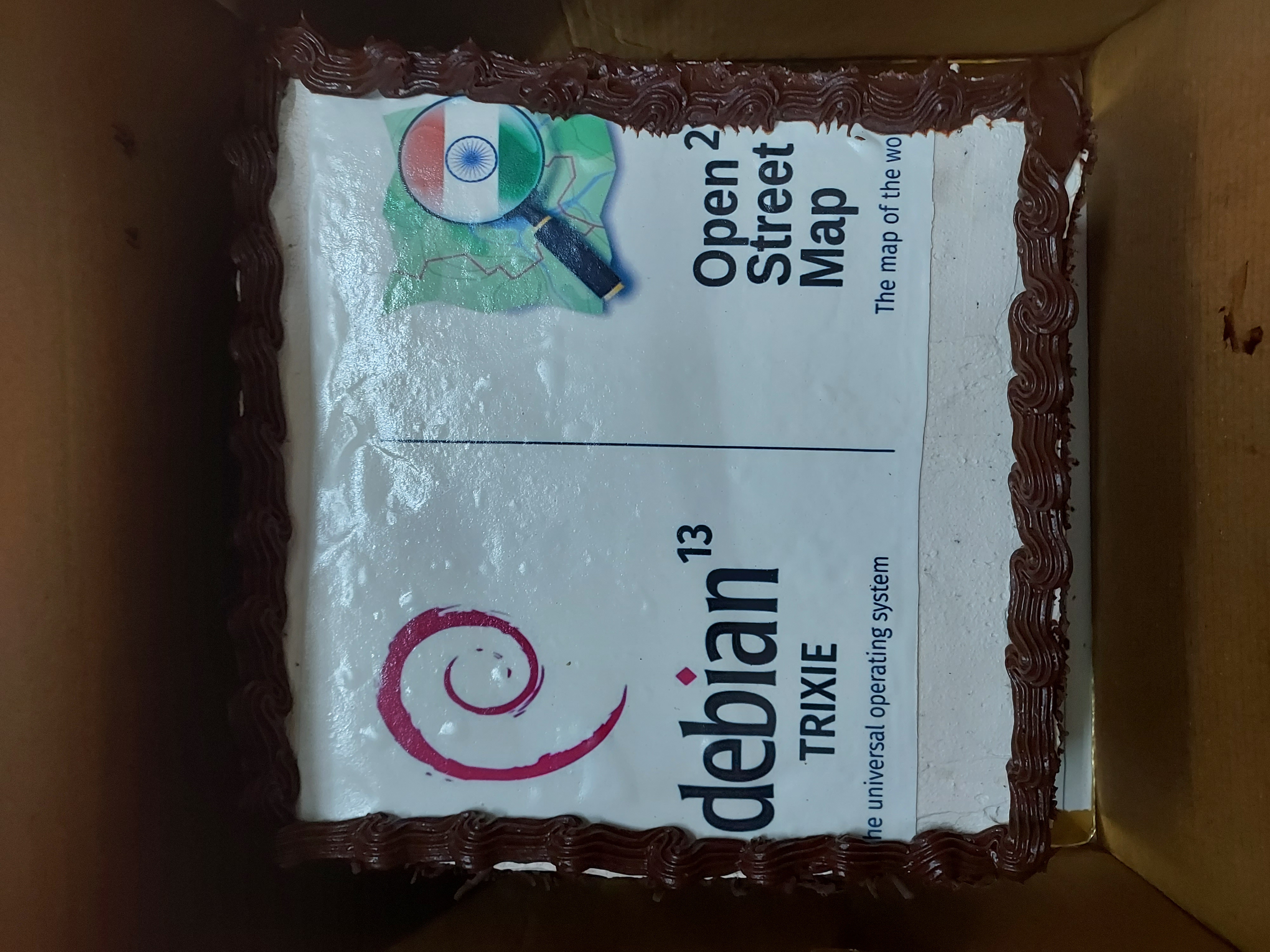 Cake picture with Debian trixie and OSM 21st logo