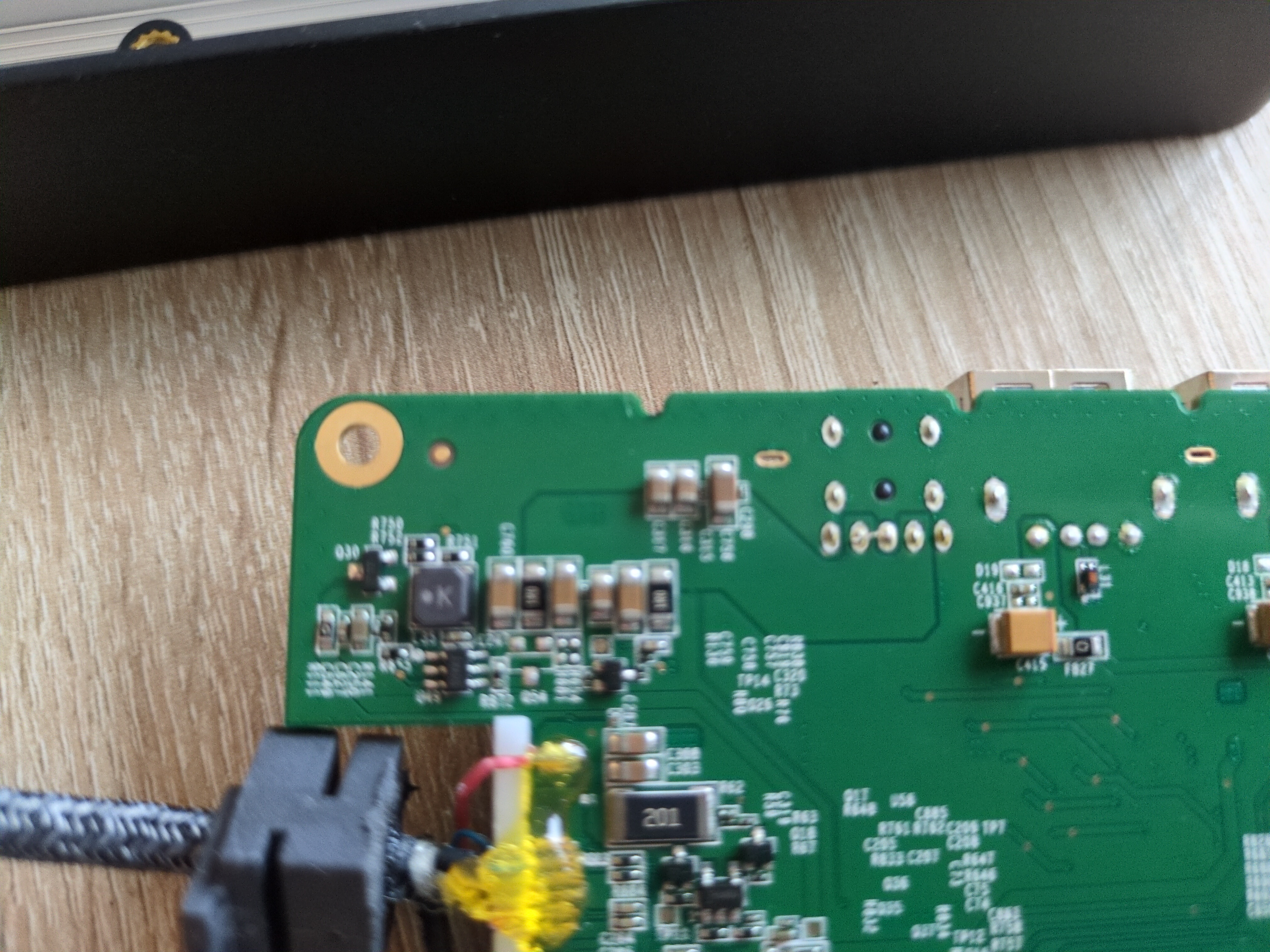 A closeup of a PCB, on the left is a USB-C cable attachted