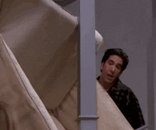 Ross from friends carrying a sofa and calling 'pivot'