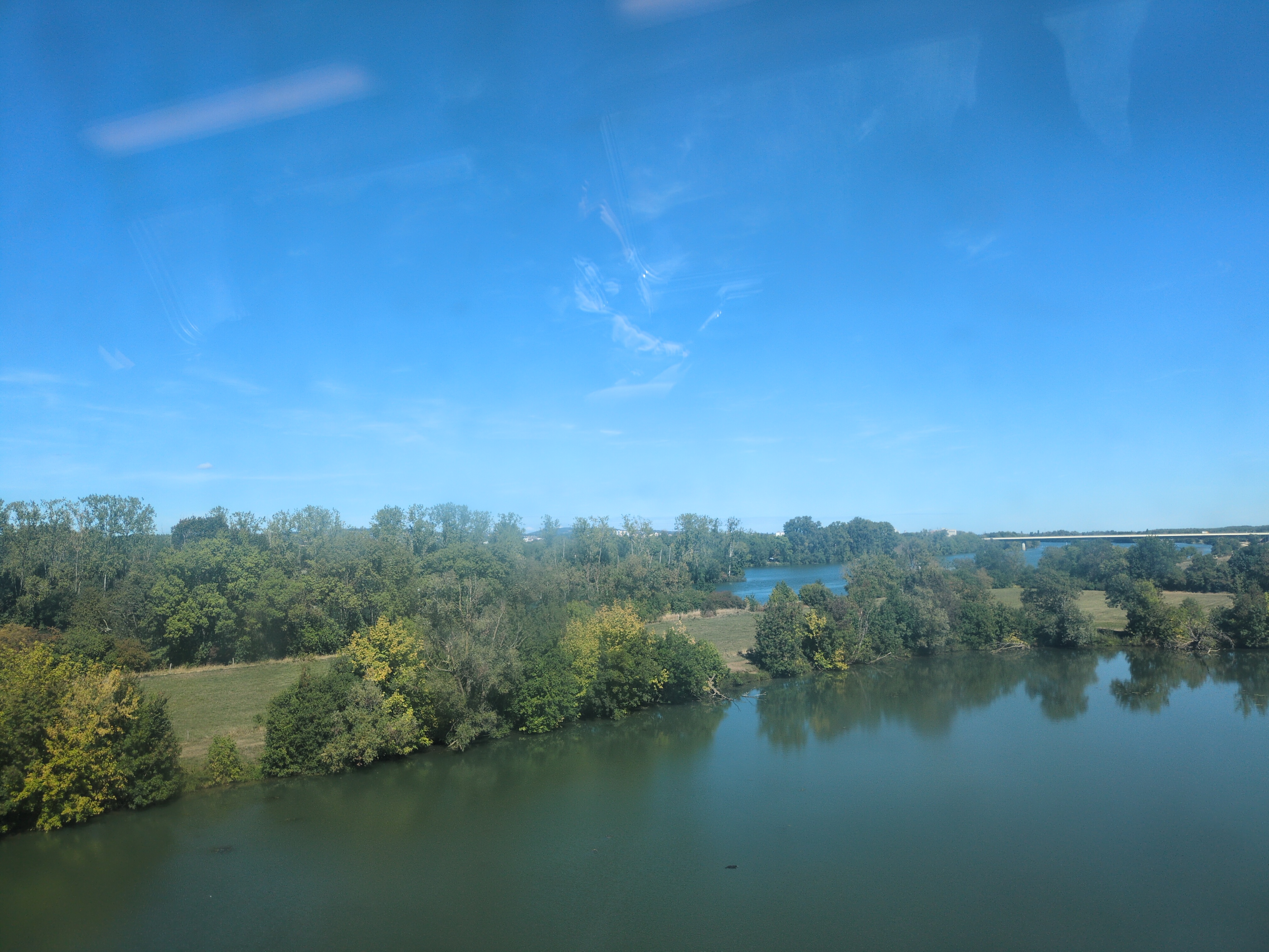 A picture of the Rhone taken from inside the train