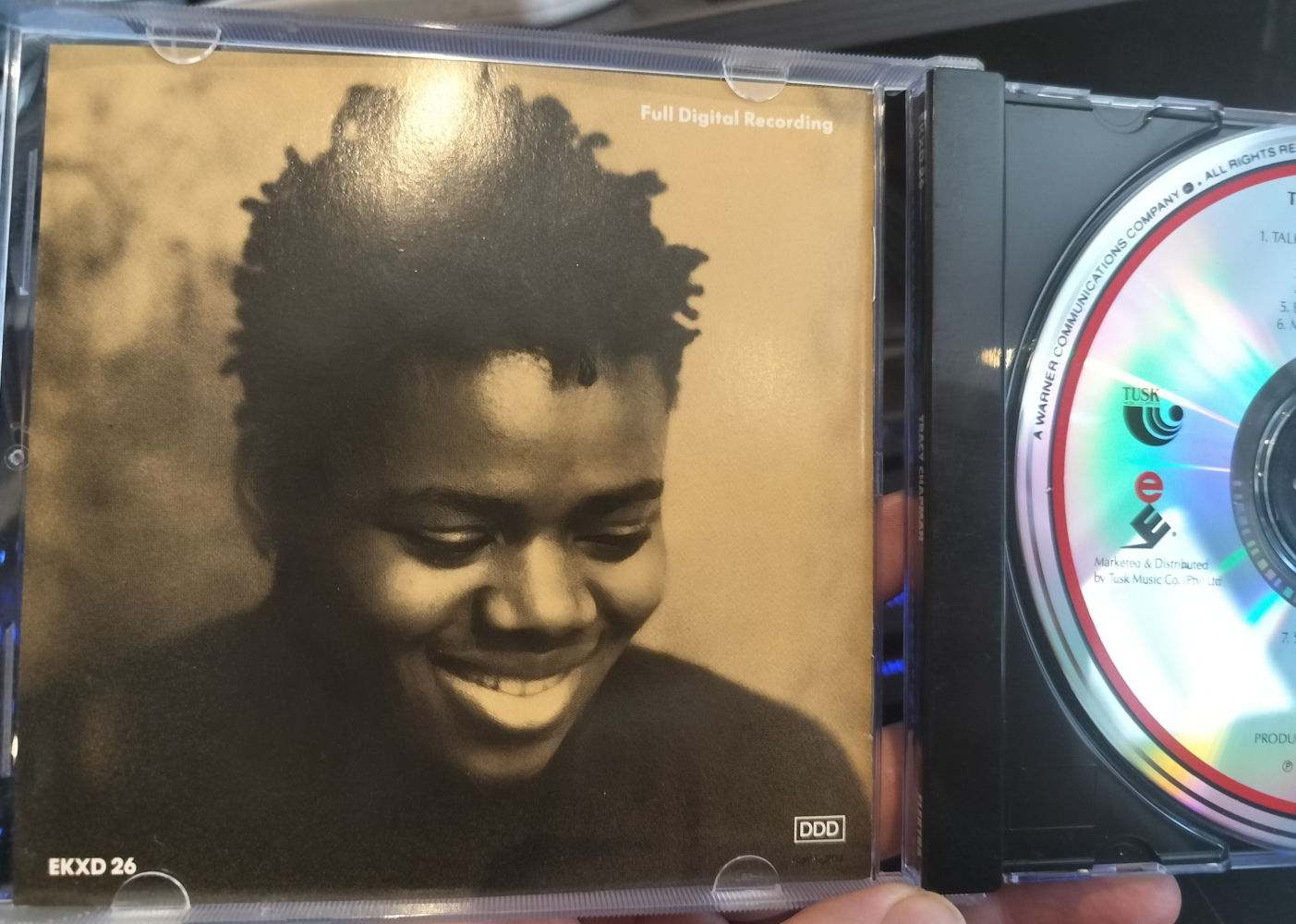 Inside sleeve of album, it looks similar to the photo on the cover, but Tracy is smiling.