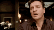 Nathan Fillion as firefly's Captain going 'wait' on himself.